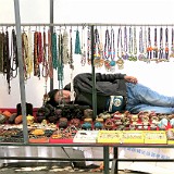 Slow Businesss - Quick Nap  Because of the recent earthquake, many tourist don't come to Tibet anymore - as a result, the souvenir buisness is going slow, givinig plenty of opportuninty for an early afternoon nap :-)